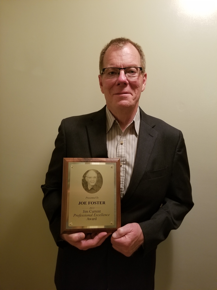 Photo of Joe Foster with award