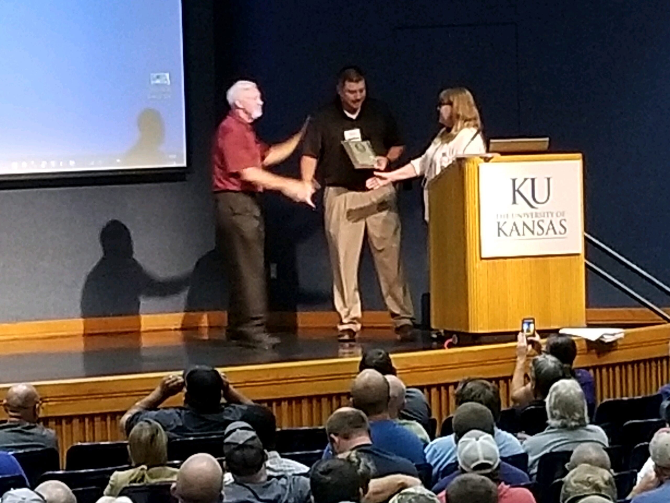Photo of Heath Horyna receiving the Jim Current award