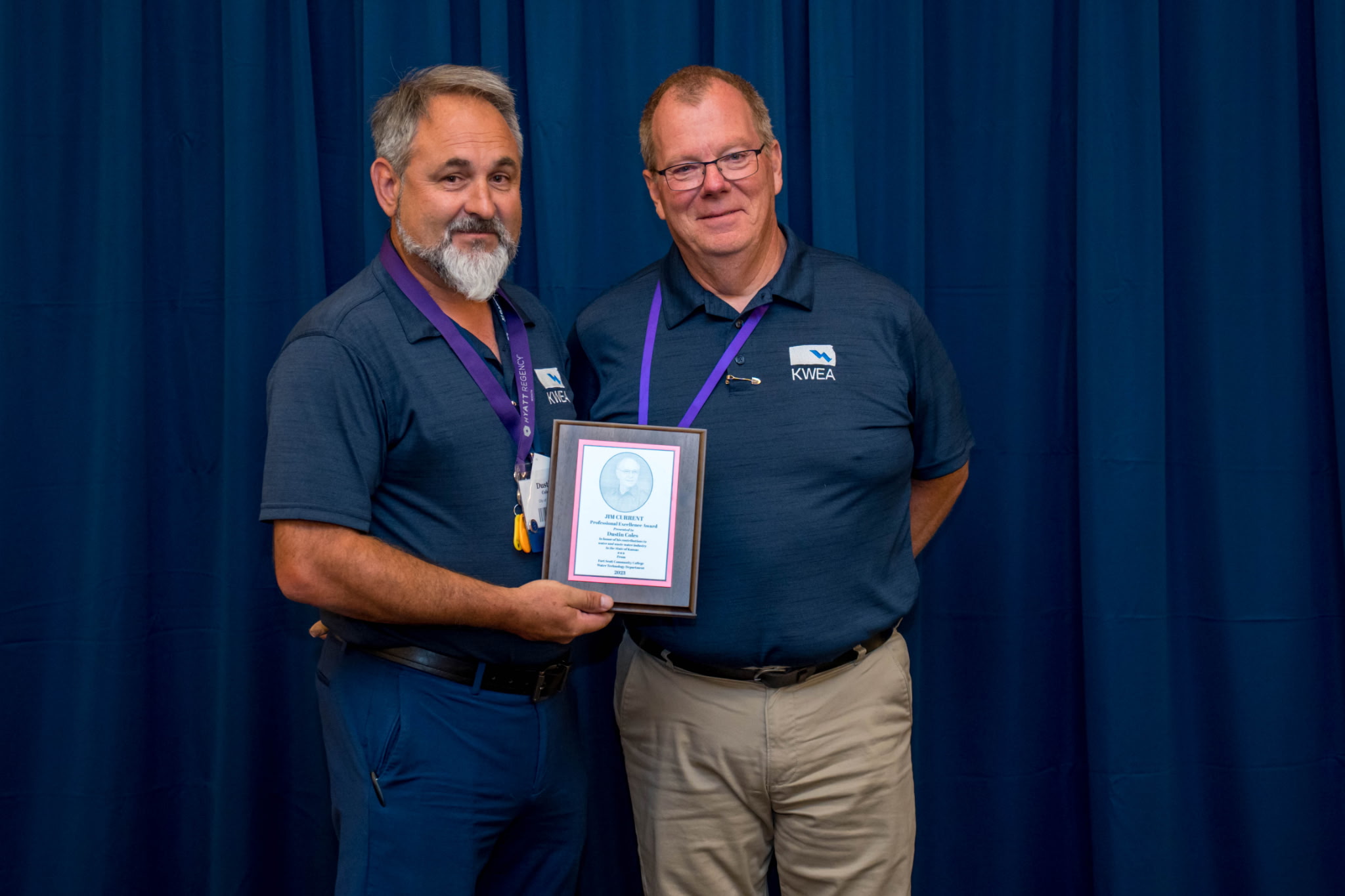 Photo of Dustin Coles receiving an award