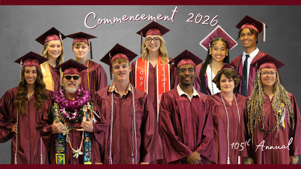 Group of graduates in maroon caps and gowns posing for a Commencement 2026 photo, with “105th Annual” text in the lower right.